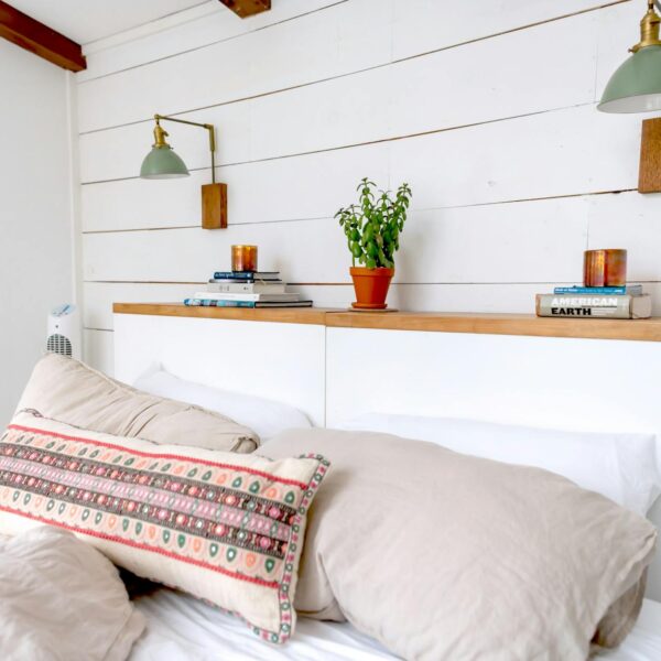 cozy minimalist bedroom with green accents